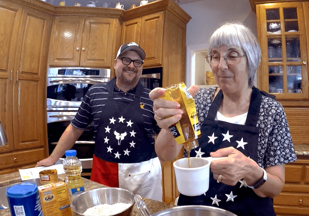 Photo of beekeeper Matt Beekman and Angel Baker Kitty Harmon.